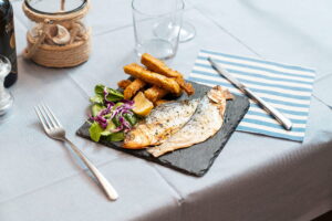 Pesce di lago alla griglia con polenta fritta